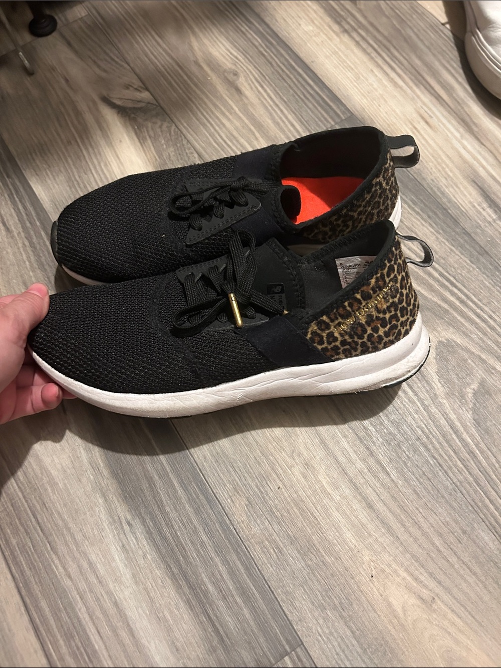 New Balance Black Sneakers with Leopard Heel Accent